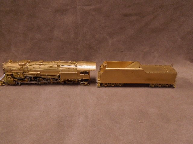 HO Scale Locomotive & Tender: HO Scale Brass Locomotive and Tender Made in Korea marked Woo Yang Korea. CONDITION: Good used, no boxes.