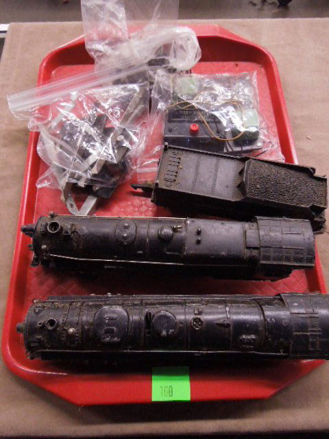 Vintage American Flyer Scale Train Lot: Vintage American Flyer O-Scale Train lot includes: #312 Engine and Tender, #322 Engine, uncouper switch and track control clips. CONDITION: Fair, used.