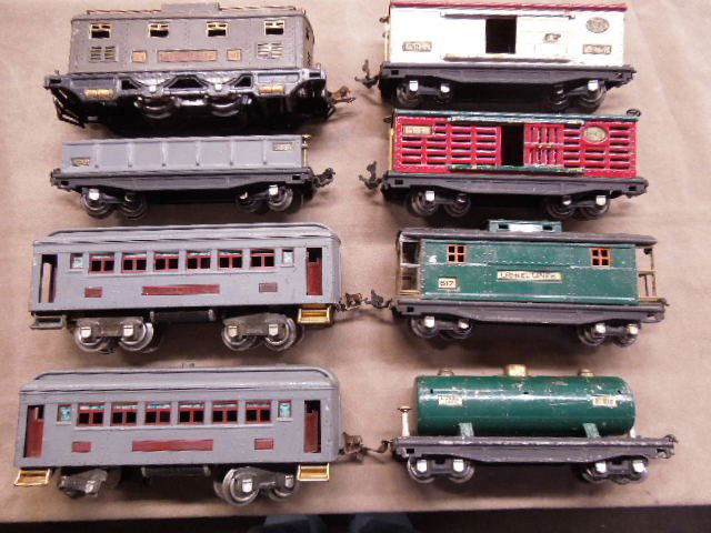 Vintage O-Scale Lionel Pressed Steel Train Set: Vintage O-Scale Lionel pressed steel train set includes: Locomotive #251E, 7-Cars and One Car Body. CONDITION: Fair, used, shows wear.