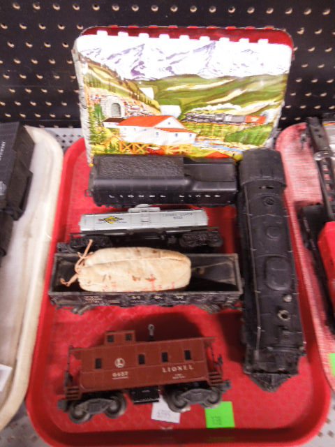 Vintage Lionel O-Scale Train Lot: Vintage Lionel O-Scale train lot includes: Engine #2056 and #2046 Whistle Tender, Sunoco Car #6035, Norfolk and Western #22000 Hopper Car, Caboose #6457, and pressed steel tunnel. CONDITION: Fair, use