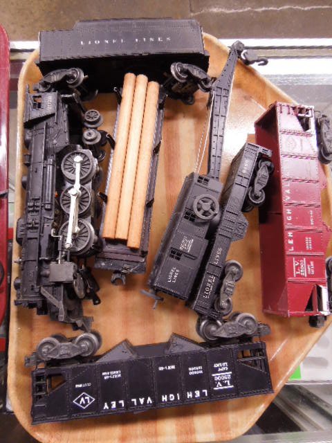 Vintage Lionel O-Scale Train Set: Vintage Lionel O-Scale train set includes: #2026 Engine with whistle tender, 2 Lehigh Valley #2500 Hopper Cars, #6460 Crane Car, and #3461 Lumber Car. CONDITION: Fair, used.