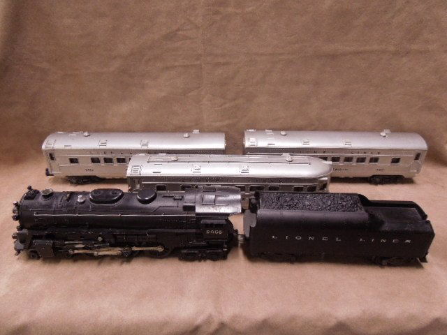 Lionel O-Scale Passenger Train Set: Lionel O-scale train set, includes: #2055 locomotive, #2046W whistle tender, #2421 Maplewood passenger car, #2422 Chatham passenger car, #2423 Hillside passenger car. CONDITION: Good, used, minor bend