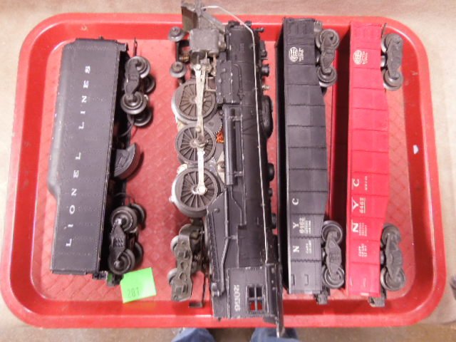 Lionel O-Scale Train Lot: Lionel O-scale train lot. Includes: #2080 locomotive, #2046W Whistle tender & (2) NYC #662 Hopper car. CONDITION: Fair, used, shows wear.
