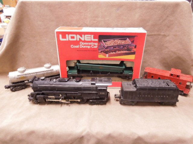 Lionel O-Scale Train Lot: Lionel O-scale train lot, includes: #665 engine & tender, #6-16707 operating coal dump car, Sunoco tanker & 36357 caboose. CONDITION: Fair, used.