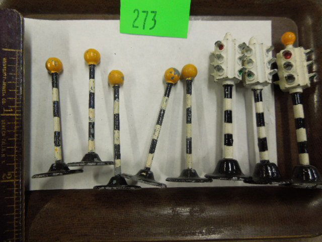 Dinky Toy Traffic Lights & Beacon Poles: Dinky Toy traffic lights & beacon poles including: three 2 1/2" robot traffic lights & five 2" beacon poles, black 7 white strip, yellow ball top, no boxes, mid century. CONDITION: Some paint loss on