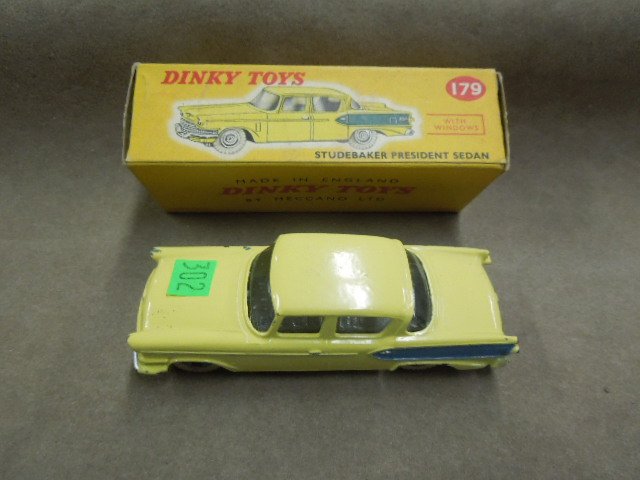 Dinky Toy Car, #179: Dinky toy car, #179, Studebaker President Sedan, yellow with blue accents on side & wheels, white tires, with windows, original box, 4 1/4", mid century. CONDITION: Minor wear to box, some paint loss 