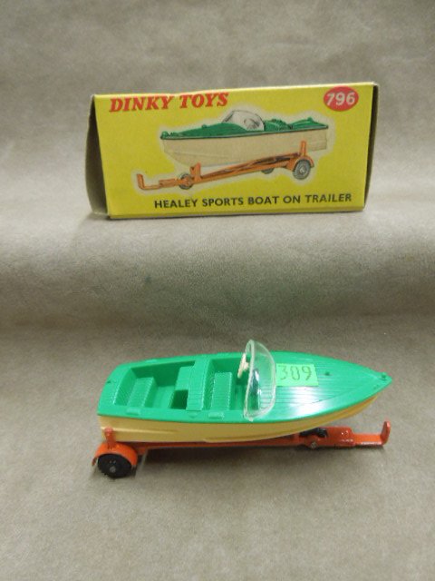 Dinky Toy Boat & Trailer # 796: Dinky toy, Healey sports boat on trailer, green & beige boat with red trailer, original box, 4", mid century. CONDITION: No issues noted.