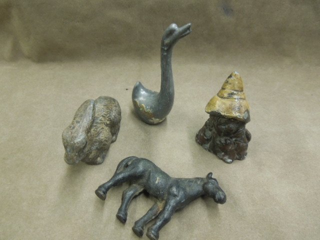 2 Lead Animal Figures & Gnome: Two lead animal figures, including: rabbit, 3 1/2", goose, unpainted with bronze wing accents, 4"h, one gnome, brown with yellow hat, 3", plus one small iron horse, 3". CONDITION: Paint loss to gnome 