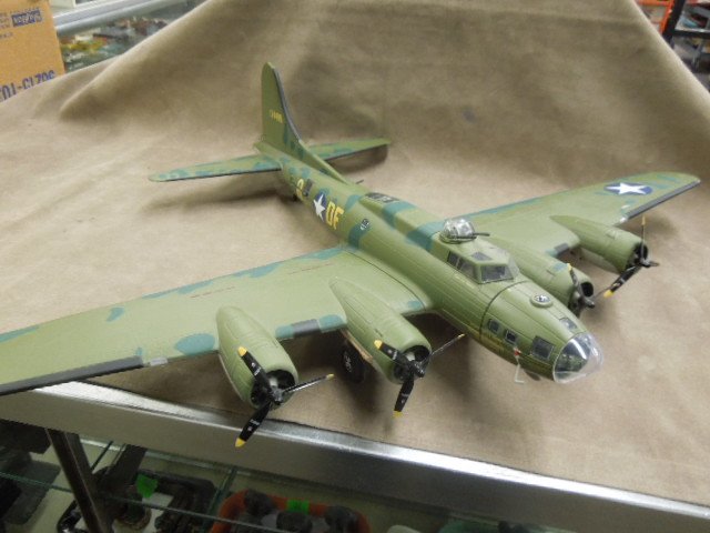 Die Cast Fighter Plane: Die cast fighter plane B-17 Flying Fortress FMPM, "Memphis Belle", 4 engine, movable propeller, top & belly turret guns, side & back turret guns, listed crew on plane, pilots - Capts. R.K. Morgan & Ji