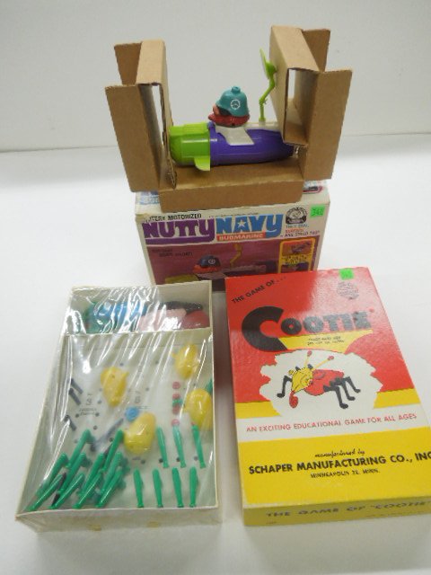 Cootie Game & Submarine: Cootie Game in original box by Schaper with all pieces (loose in box under plastic, plus Nutty Navy Submarine in original box by Remco Condition; some wear to boxes, especially submarine