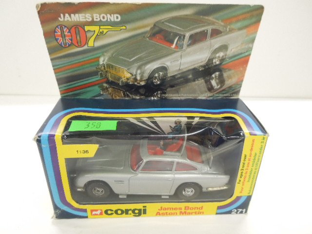 Corgi Toy Car 007 # 271: Corgi Toy Car 007 # 271, James Bond Aston Martin, retractable machine gun, ejector seat, bullet screen, telescopic over riders, figure, in original package, 5" mid century Condition; in box, box has s