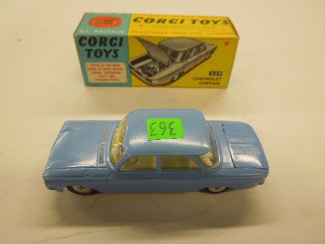 Corgi Toy Car # 229: Corgi Toy Car, Chevrolet Corvair Glidamatic spring suspension with windows, cover at the rear opens to show engine, spring suspension, seats and steering wheel, original box,, mid century Condition; m