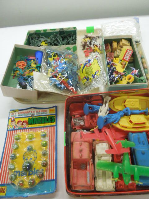 Large Lot Plastic Toy Figures & other: Large Lot Plastic Toy Figures & other including; Cavalry & Indians, monkeys, green soldiers, stamps, cars, planes and boats, marbles Condition; some new in packages, others have minor wear, wear to ca