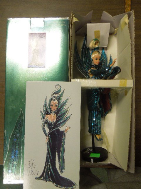 Bob Mackie "Neptune Fantasy" Barbie: Bob Mackie "Neptune Fantasy" Barbie, 4th in a series, in original box with original Bob Mackie reproduction of original drawing on cardboard, with standCondition; box has some wear, doll and reproduct
