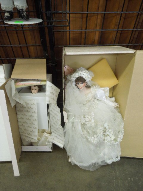 2 Porcelain Dolls: 2 Porcelain dolls, (1) Ashton Drake, "Elizabeth's wedding dress, # 1900, 22" and (1) Maryse Nicole, "Vanessa, 24", both with certificates of authenticity and original boxesCondition; minor wear