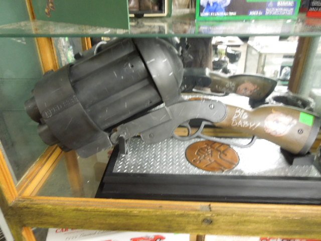 Hellboy II "Big Baby" Prop Replica: Hellboy II "Big Baby" Prop Replica BPRD333 with 6 shells, belt and display stand. Model #8932 Condition: New out of box.