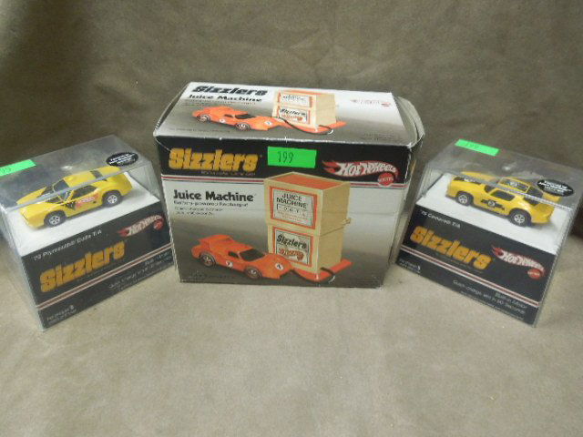 3 Hot Wheels Sizzlers diecast cars & Juice machine: 3 Hot Wheels Sizzlers die cast cars including; (2) cars 1970 Camaro and Plymouth Cuda, both with built in motors (quick charge em), plus Sizzlers "Juice Machine" battery powered recharger (quick charg