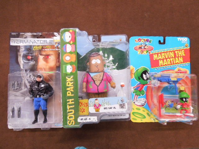 3- Assorted Action Figures: 3- Assorted Action Figures. Including: Mezco Big Gay Al from Southpark, Tyco Marvin the Martian & Kenner Terminator 2 Cop. Condition: All in original packaging.