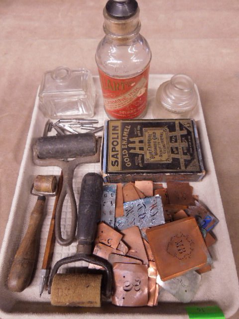 Vintage inking tools and bottles: Vintage inking tools and bottles including 3 rollers, 2 with wood handles, Sapolin gold enamel in original box, 3 ink bottles, 2 without stoppers, copper stencils, and nibs. Condition: Minor wear