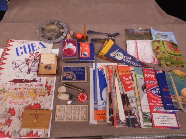 Lg Lot 1939 N.Y. Worlds Fair items: Lg Lot 1939 N.Y. Worlds Fair items including Schaefer Center menu, souvenir mirror and playing cards in original boxes, assorted pamphlets and maps, guide book, needle book, (7) small penants, bakelit