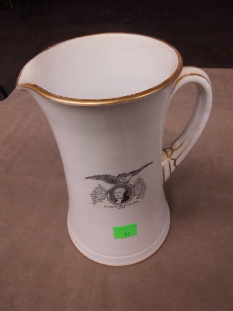 US Centennial Washington memorial pitcher: US Centennial George Washington "A Memorial" porcelain pitcher with Washington portrait eagle and flags on front, gold accent on top bottom and handle. 11", manufactured by W.T. Copeland & Sons solely