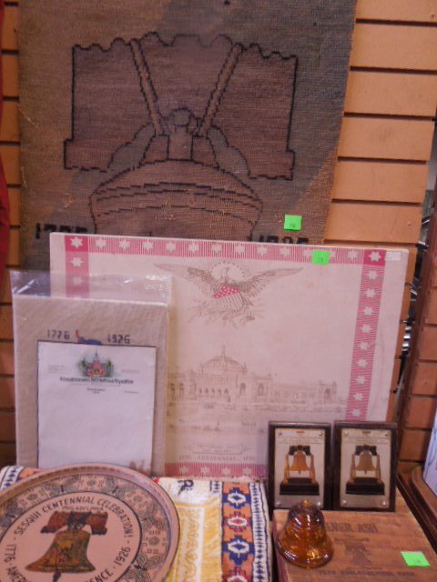 Centennial, Sesqui & Bicentennial items: Centennial, Sesqui & Bicentennial items including; 18 3/4" x 25 1/2" Centennial illustration on fabric, memorial hall, Sesquicentennial Liberty Bell throw rug, small needle point, tin tray, color engr