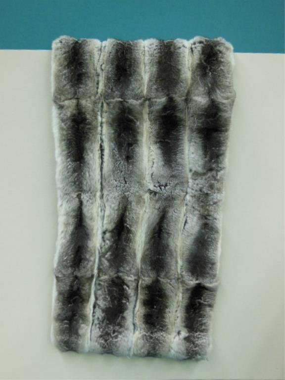 Chinchilla Stole: Chinchilla stole, 46" x 15 1/2' with zipper on one side. Flocked metallic lining, monogrammed. CONDITION: Good but 15" tear between pelts, velvet ribbon needs stitching.