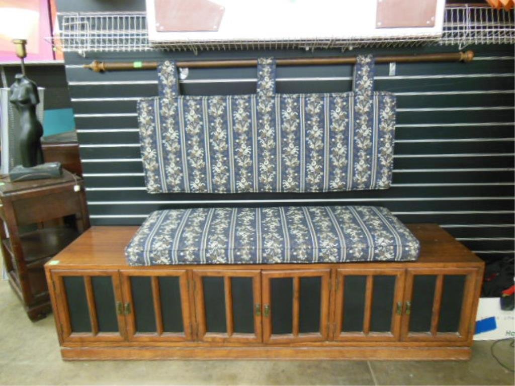 Danish Modern Credenza: Danish modern credenza, teakwood, six black faux leather recessed panel doors, plinth molded base, c 1960, 72" x 19 1/2" x 18", plus 2 loose pillow cushions. CONDITION: Some surface scratches.