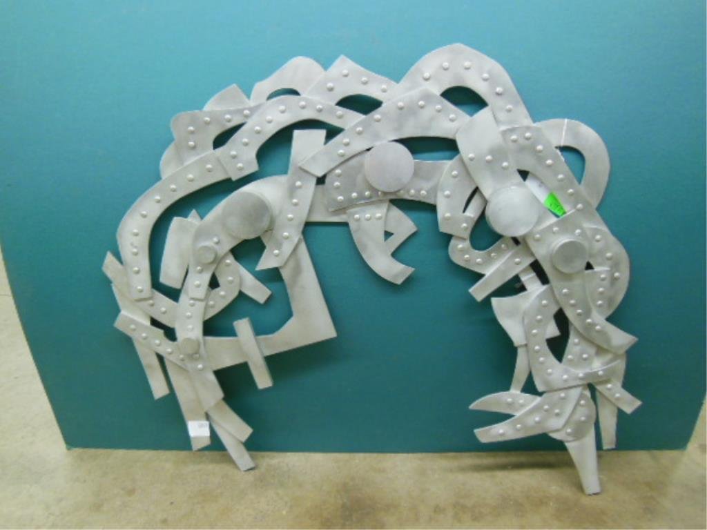 Bernard Petlock, Aluminum, "Silver-Sonata II": Unsigned (Bernard Petlock), aluminum wall sculpture, "Silver Sonata II" [title in ink marker verso]. [Provenance: Collection of the Woodmere Art Museum, Philadelphia]. 27 3/4" = L CONDITION: No issues