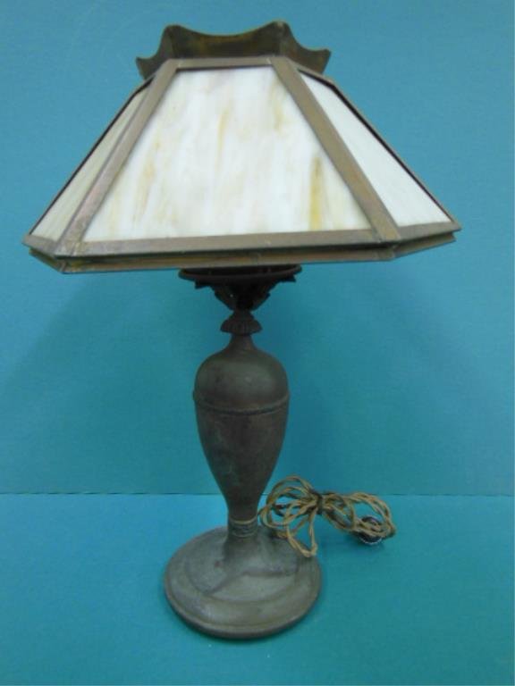 Slag Glass Table Lamp: Slag glass table lamp; hexagonal carmel slag glass paneled shade (16" d), on a brass ballister form base with circular foot, early 20th C, 21" h. CONDITION: As found - brass badly tarnished, working c