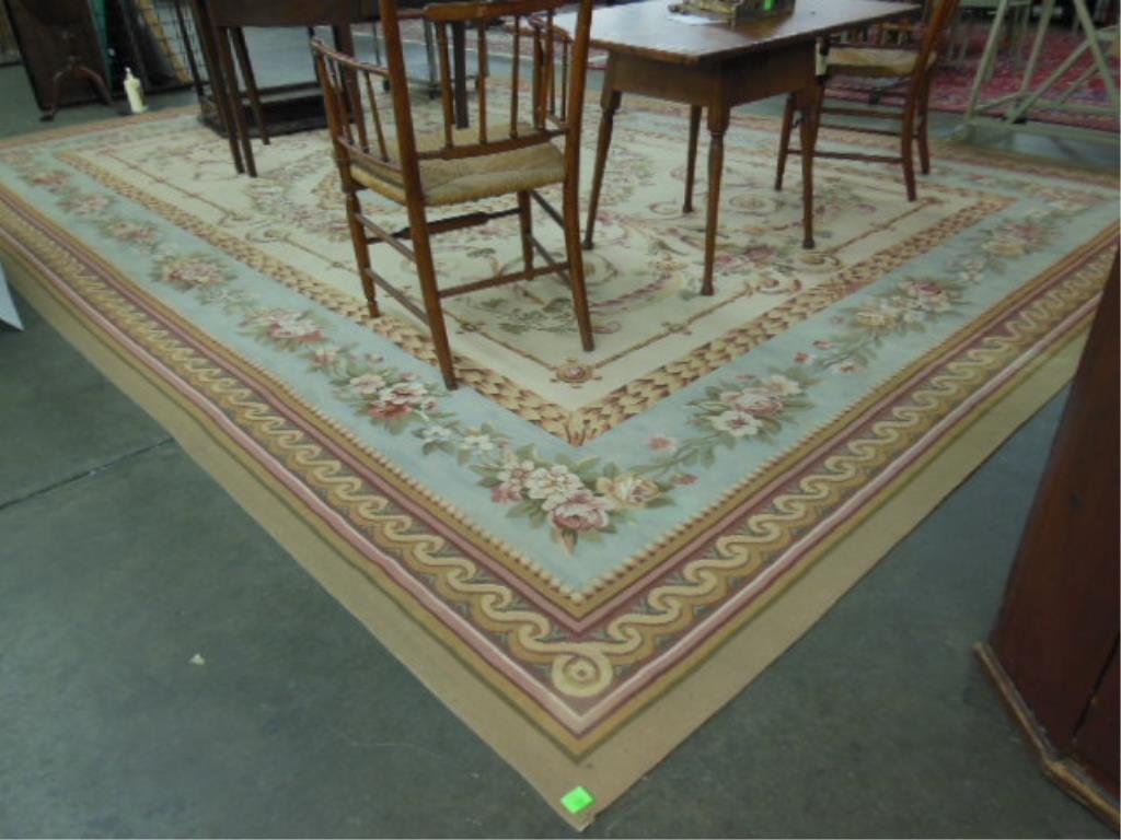 Ballroom-size Aubusson Carpet: Ballroom-size Aubusson carpet, light peach field with green, pink, dark red, pale blue. 15' 10" x 10' 6". CONDITION: Light soiling; no other issues identified.