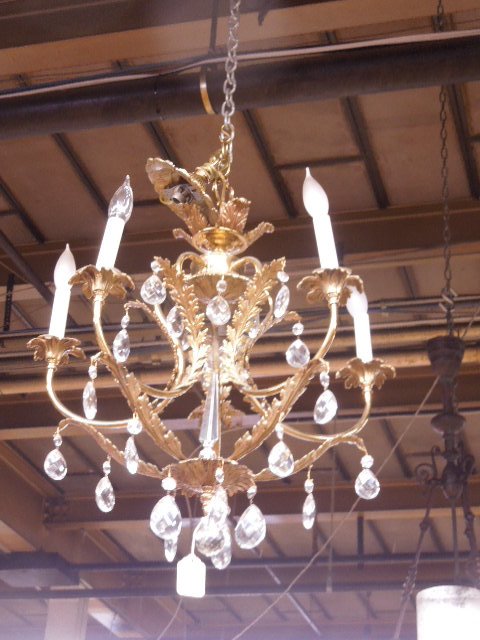 Brass Chandelier: Brass chandelier, 5 light with acanthus scroll embellishments and cut crystal teardrops and central spear, mid 20th c. 24"h, 22"d. CONDITION: No issues noted.