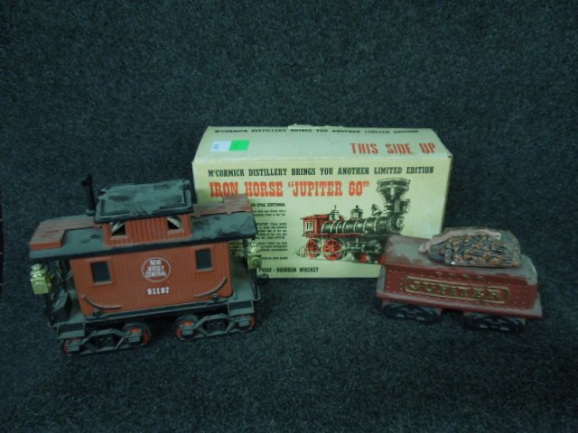 3 RR Train Car Bottles: 3 RR Train Car Bottles, including: McCormick, engine & tender, Jupiter 60, original box, Beam NJC caboose. CONDITION: Open & empty, minor wear.