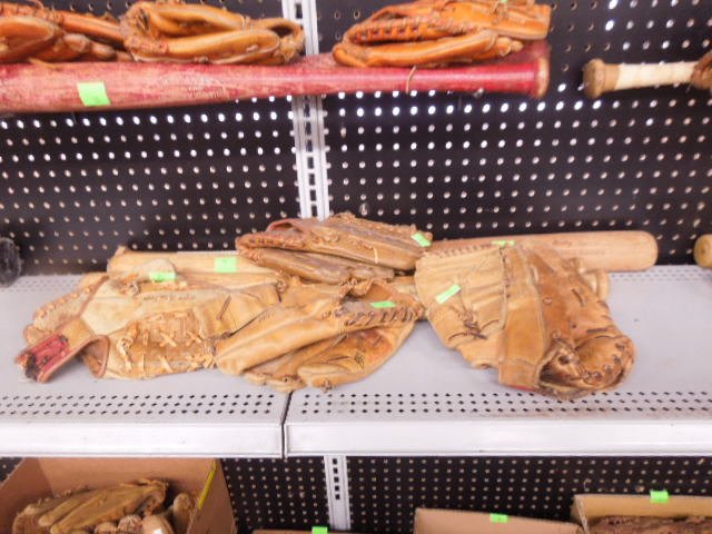 Mickey Mantle baseball bats and gloves (1 of 3)