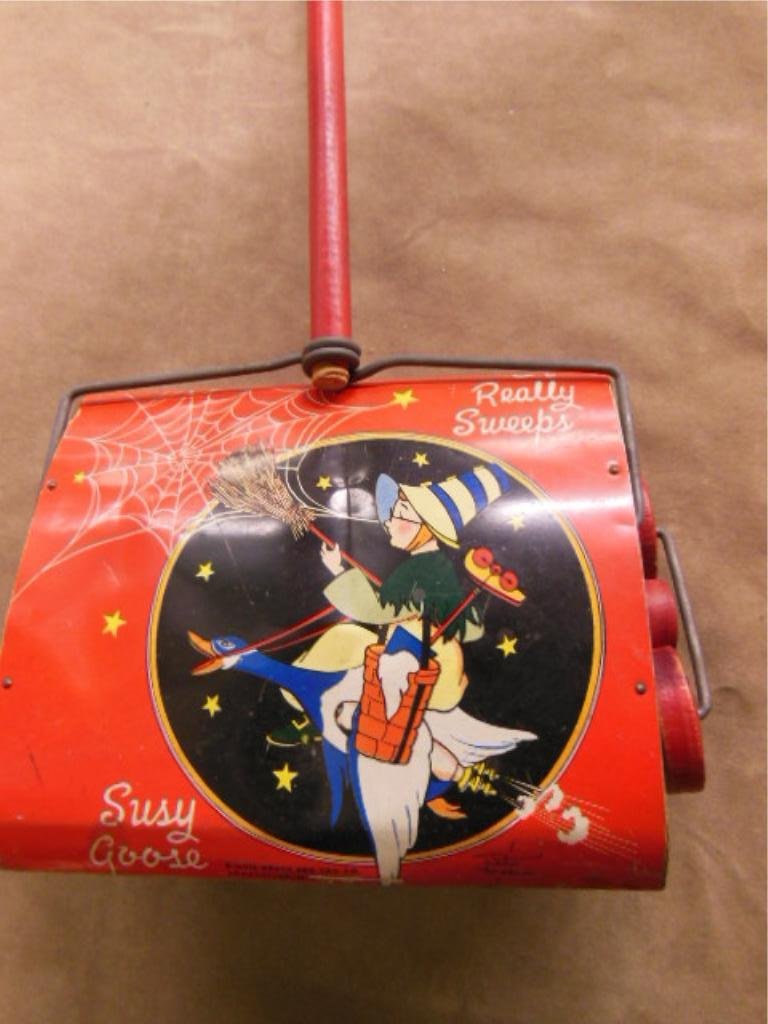 Susy Goose push sweeper: Susy Goose push sweeper, Kiddie Brush & to Co. Jponesville Michigan. has wood handle. Cond: Wear and dents on tin sweeper body, otherwise minor wear.