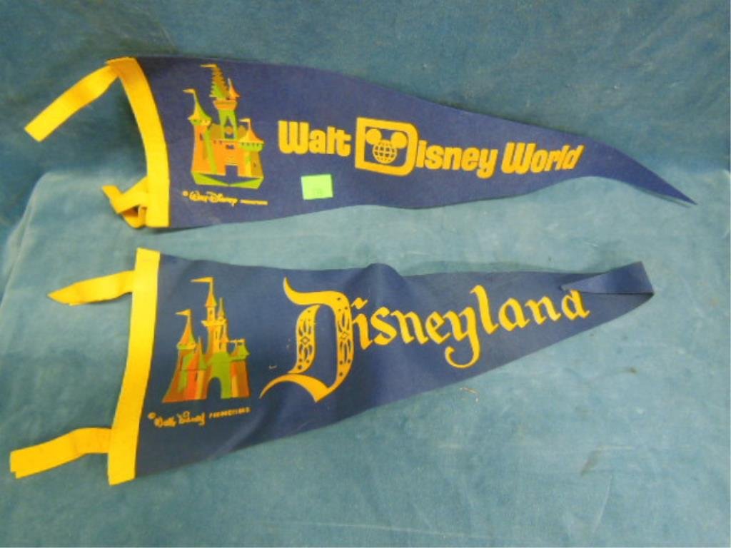 2 Vintage Disney Theme park pennants: 2 Vintage Disney Theme park pennants, Disneyland and Walt Disney World, 24" each Condition; minor wear and some wrinkling to Disneyland pennant