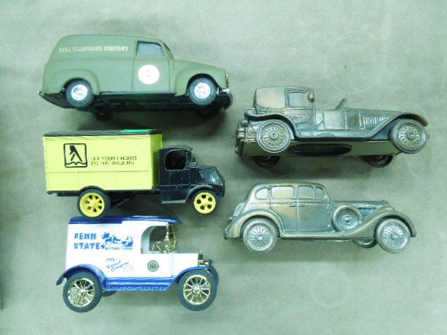 5 Die cast car and truck banks: 5 Die cast car and truck banks, including; Penn State, Yellow Pages and other Condition; some wear from age and display