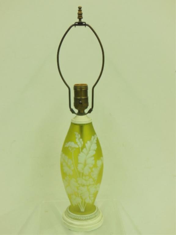 Webb Cameo Glass Lamp: Antique Webb cameo glass 19" (h) vasiform lamp, yellow/vaseline glass 8 3/4" (h) vase with a white cameo cut floral design, drilled and converted into a lamp. [110] CONDITION: Very good condition with