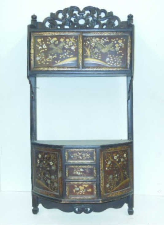 Antique Japanese Wall Cabinet: Mid 19th to early 20th c Japanese hardwood 35 1/2"(h) x 17 1/2" (l) x 1" (w) hanging wall cabinet, inlaid with bone birds and floral rosettes and mother of pearl rosettes, painted gilt highlights. [44