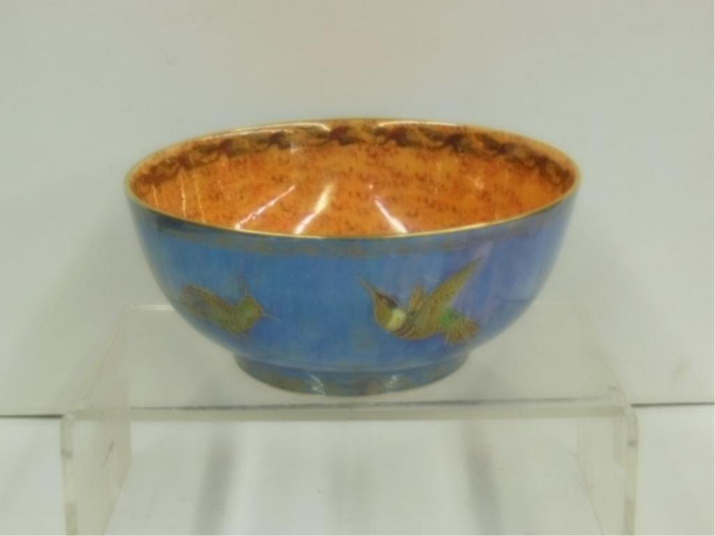 Wedgwood Hummingbird Lustre Bowl: Circa 1920 Wedgwood porcelain Hummingbird Lustre Z5294 pattern 4 1/2" (h) x 9 3/4" (l) bowl, mottled blue exterior, mottled orange/red interior, Portland vase printed mark on base. [82] CONDITION: Ver