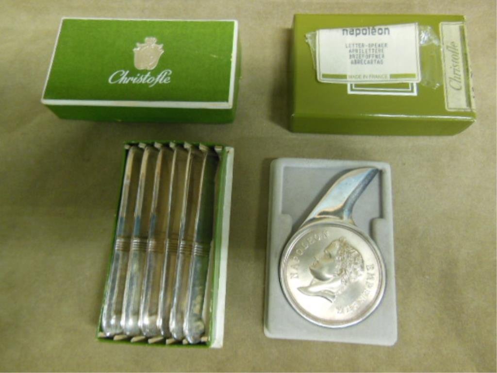 Christofle Letter Opener and Pate Knives: Vintage Christofle silverplate Napoleon III 2"(d) x 3 1/4"(w) letter opener with its original box and a set of six Art Deco style 3 7/8"(d) x 1/2"(w) pate knives with their original box. CONDITION: Ve