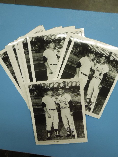 25 Mantle / Musial unframed photos: 25 Mantle / Musial unframed photos, 8" x 10", black and white Condition; minor wear, stain on Mantles pants is "in photo"