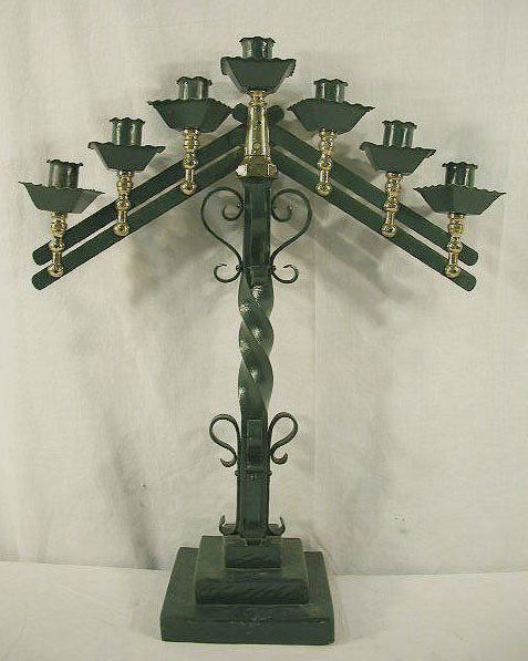 Sabbath candelabra, bar type: Sabbath candelabra, 22"h x 17" bar type in hunter green painted iron with cast brass candle supports. Features square cup bobaches, applied "s" scrolls to the twisted column: 3 tier square base. Circa