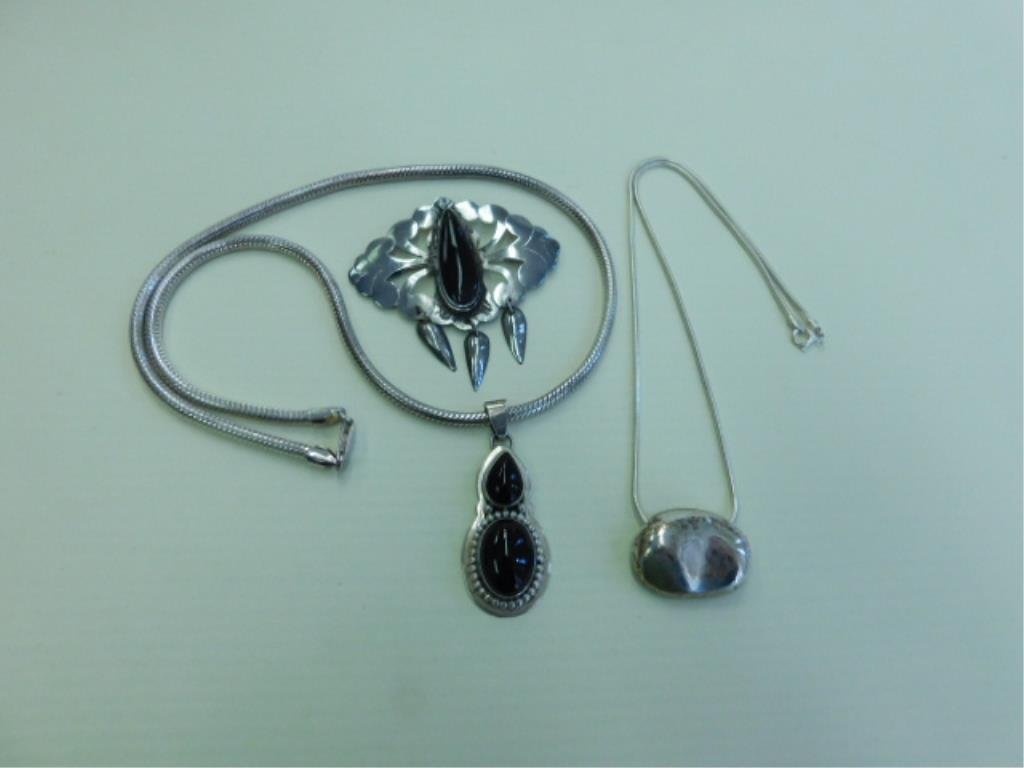 Sterling & Onyx Jewelry Group: 20" heavy foxtail chain (1.55 ozt) w/black onyx pendant signed "Bea Tam", (.35 ozt.), 16" chain w/oval enhancer (.75ozt) & open work pin w/tear drop black onyx & 3 inverted tear drop pendants. All mar