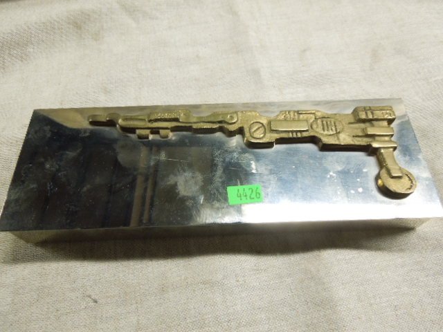 Modern Era Industrial Designed Steel Box: Mid century modern era unsigned 1 1/2" (height) x 10 1/2" (length) x 4" (width) steel box with an applied brass industrial form design on lid, black plexiglass mounted on inner base & underside of lid