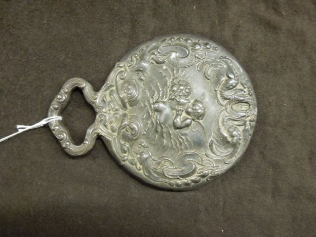 Unger Bros. Love's Dream Sterling Mirror: Circa 1904 Unger Brothers signed sterlig silver Love's Dream pattern 6 1/2" (length) x 5" (width) hand mirror. [33] CONDITION: Areas with wear. Dents along outer edge.