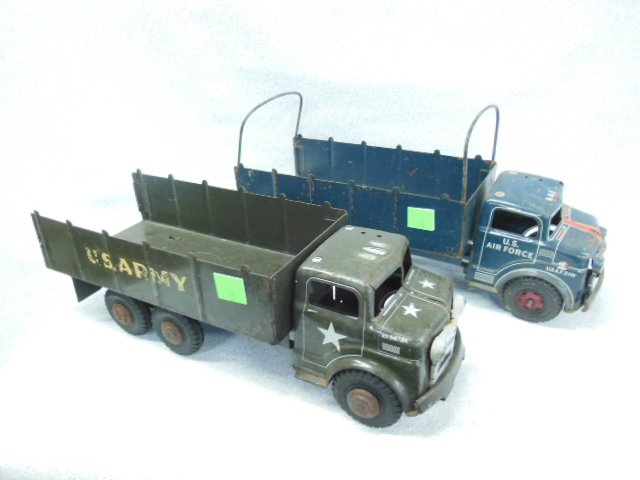 2 Vintage Lumar tin Military transport trucks: 2 Vintage Lumar tin Military transport trucks, both 19" l, with hard rubber wheels, (1) U.S. Air Force 21W fixed bed with wire canvas frame and (1) U.S. Army 5417314, fixed bed. Condition; Air Force t