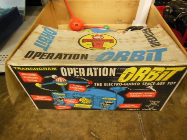 Transogram "Operation Orbit" game: Transogram "Operation Orbit" game, in original box, battery operated. Condition; missing rocket, no batteries, working condition unknown