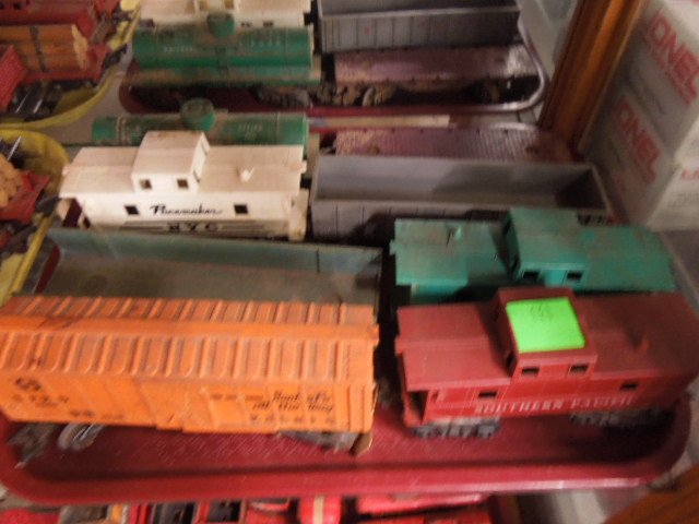 Vintage mid c. Marx & other plastic trains: Vintage mid c. Marx & other plastic trains including (2) open cars, (3) caboose, tanker car, flat car and box car. Condition; all have some wear from age and use, box car has tear in plastic 1 side mi