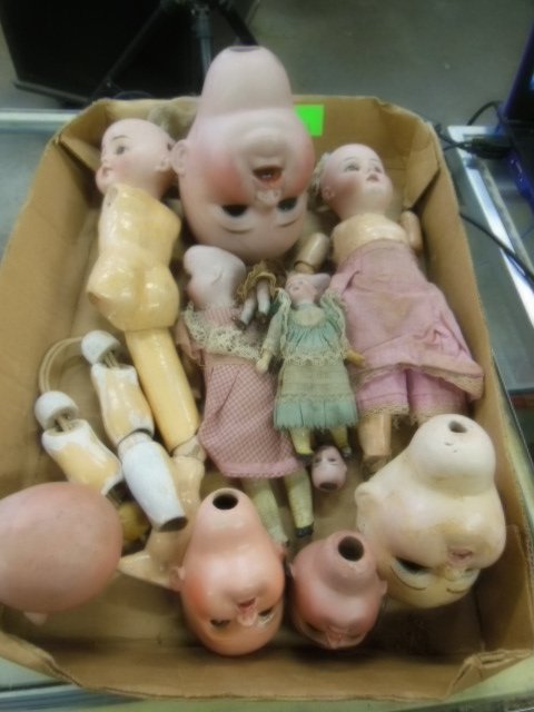Lot of doll bisque heads, some with partial bodies (1 of 8)